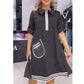 Robe trapèze noire chic pour femme avec bordure contrastante et détails de poche