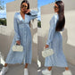 Robe fleurie tendance à manches longues, accentuant la taille, avec col en V et patte de boutonnage