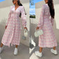 Robe fleurie tendance à manches longues, accentuant la taille, avec col en V et patte de boutonnage