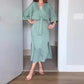 Robe élégante pour femme avec laçage à la taille, fente latérale et col en V